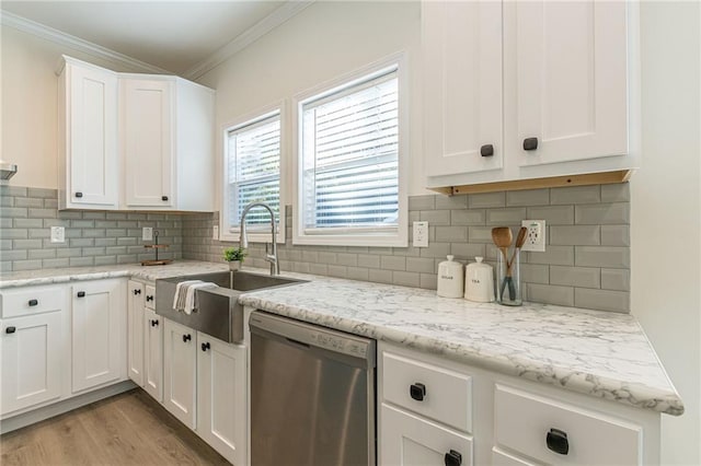 kitchen featuring dishwasher, white cabinetry, light hardwood / wood-style flooring, and decorative backsplash