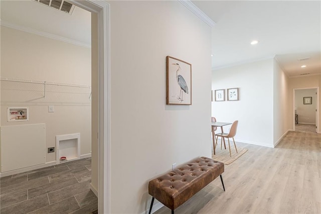 hall featuring crown molding and dark hardwood / wood-style flooring