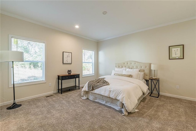 carpeted bedroom featuring ornamental molding and multiple windows