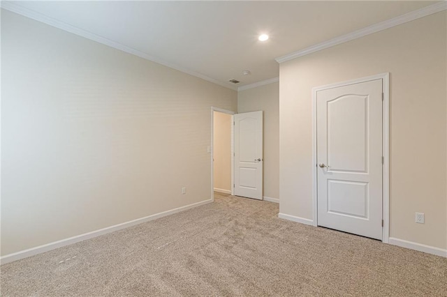 unfurnished bedroom with crown molding and light carpet