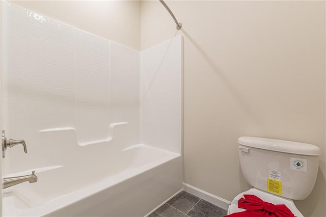 bathroom featuring toilet, tile patterned floors, and shower / bathing tub combination