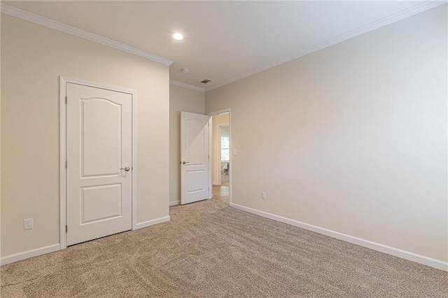 unfurnished bedroom with ornamental molding and light carpet