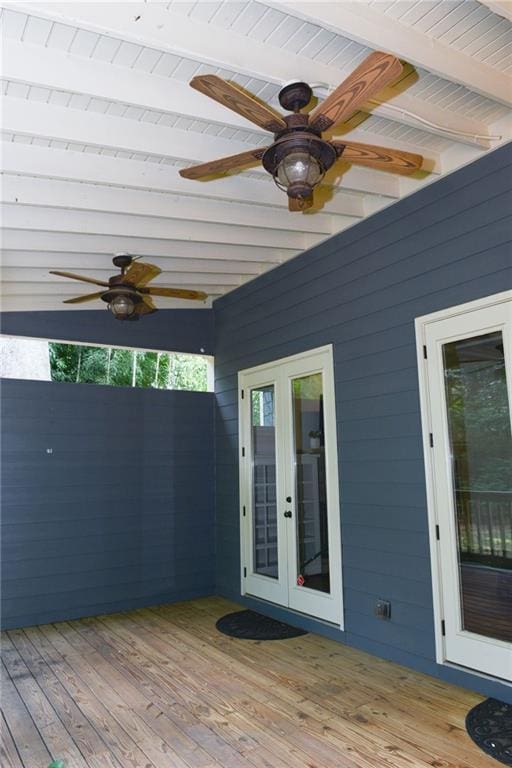 wooden terrace with ceiling fan and french doors