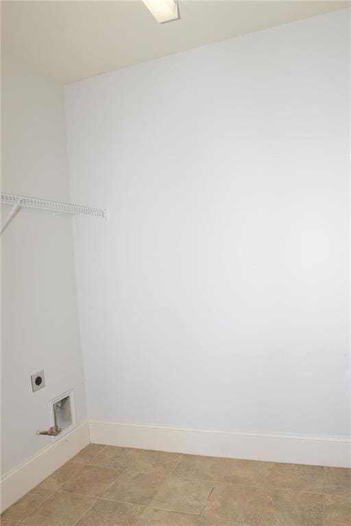 washroom with light tile floors and hookup for an electric dryer