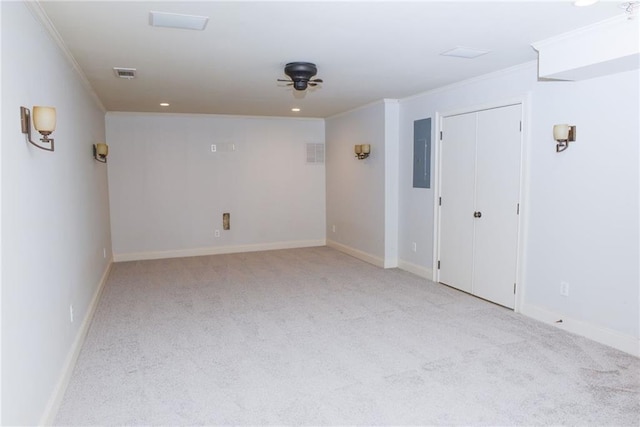 carpeted spare room featuring ornamental molding