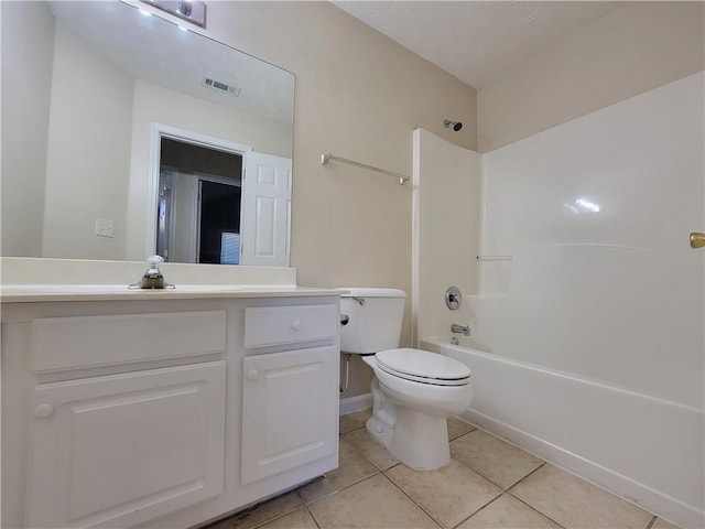 bathroom featuring tile patterned flooring, visible vents, vanity, and toilet