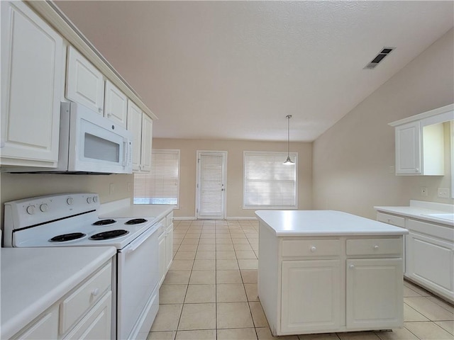 kitchen with light tile patterned floors, light countertops, visible vents, white cabinetry, and white appliances