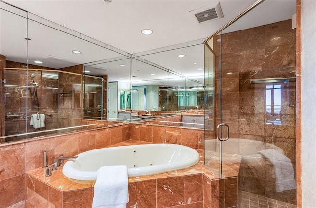 750 Park Ave NE Unit 19E, Atlanta, GA 30326 - full bathroom featuring visible vents, recessed lighting, a stall shower, and a jetted tub