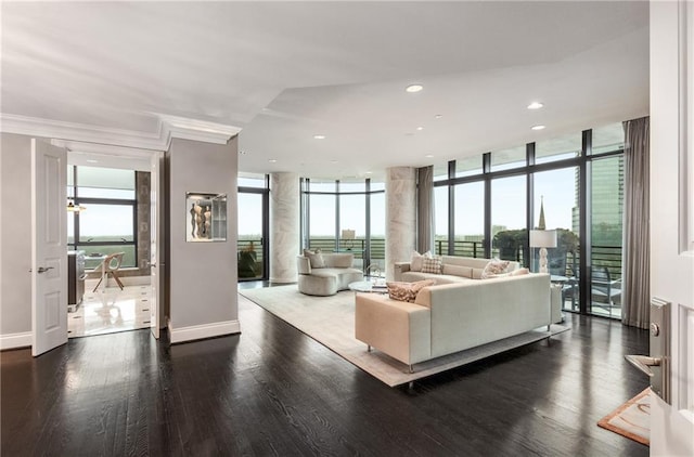 750 Park Ave NE Unit 19E, Atlanta, GA 30326 - living area featuring a wealth of natural light, floor to ceiling windows, baseboards, and wood finished floors