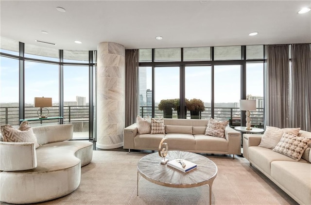 750 Park Ave NE Unit 19E, Atlanta, GA 30326 - living area featuring a wall of windows, plenty of natural light, and light colored carpet