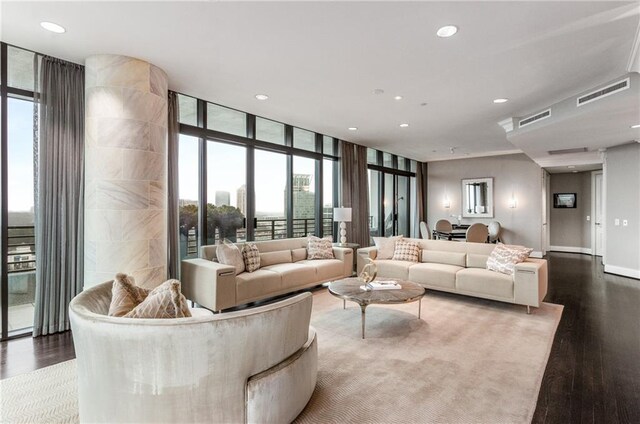 750 Park Ave NE Unit 19E, Atlanta, GA 30326 - living area with floor to ceiling windows, wood finished floors, and visible vents