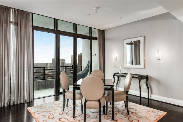 750 Park Ave NE Unit 19E, Atlanta, GA 30326 - dining area with floor to ceiling windows, wood finished floors, and baseboards
