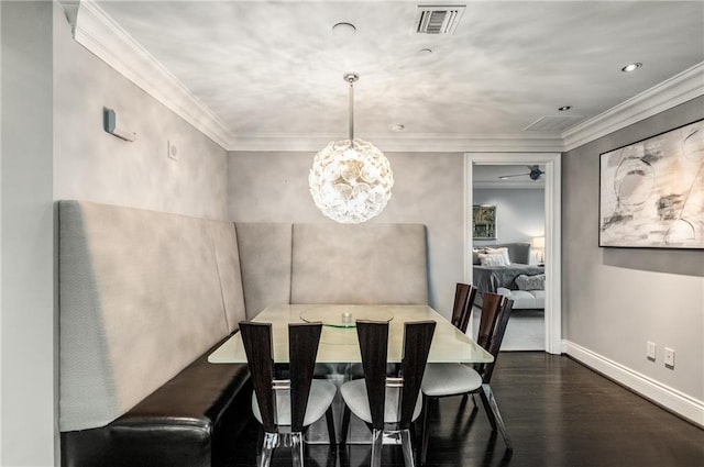 750 Park Ave NE Unit 19E, Atlanta, GA 30326 - dining space with visible vents, crown molding, baseboards, and wood finished floors