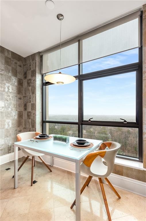 750 Park Ave NE Unit 19E, Atlanta, GA 30326 - tiled dining space with tile walls