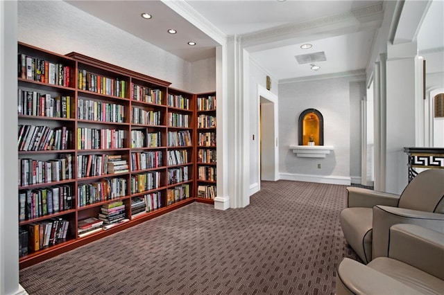 750 Park Ave NE Unit 19E, Atlanta, GA 30326 - sitting room featuring baseboards, recessed lighting, wall of books, crown molding, and carpet flooring