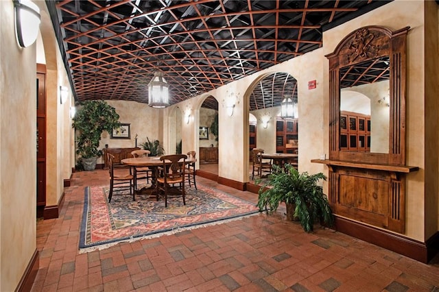750 Park Ave NE Unit 19E, Atlanta, GA 30326 - wine area featuring arched walkways, brick floor, and baseboards