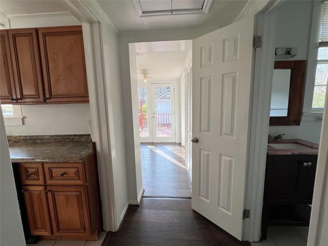 35 Elmwood St, Rome, GA 30161 - hallway featuring baseboards, a sink, crown molding, and dark wood finished floors