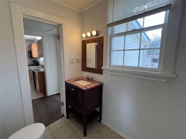 35 Elmwood St, Rome, GA 30161 - half bathroom featuring vanity, baseboards, ornamental molding, tile patterned flooring, and toilet