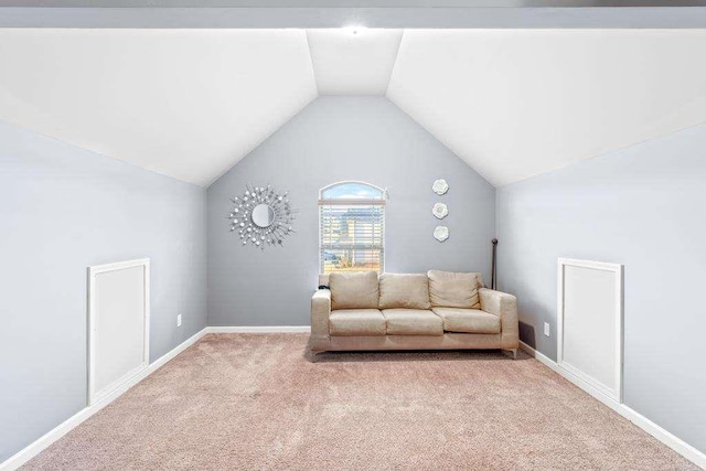 unfurnished room featuring lofted ceiling, carpet floors, and baseboards