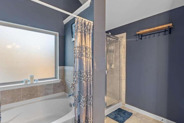 full bath featuring a stall shower, plenty of natural light, and a bath