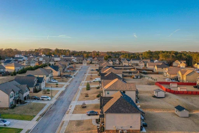 aerial view at dusk with a residential view