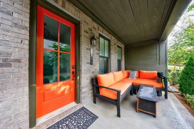 property entrance featuring an outdoor living space and brick siding