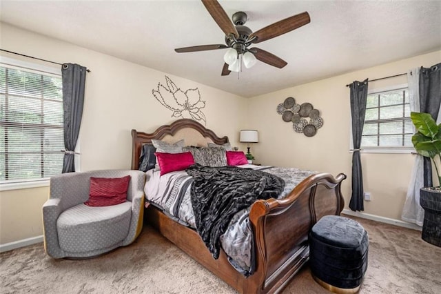 bedroom with carpet flooring, ceiling fan, and baseboards