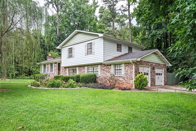 split level home featuring a garage and a front lawn