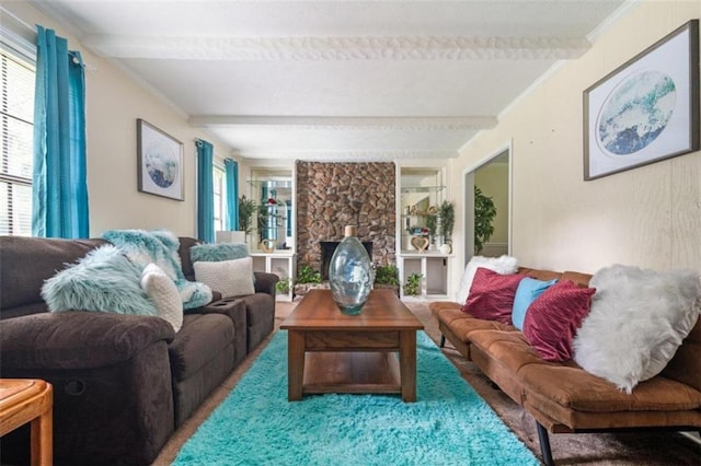 living area featuring beamed ceiling, plenty of natural light, and crown molding