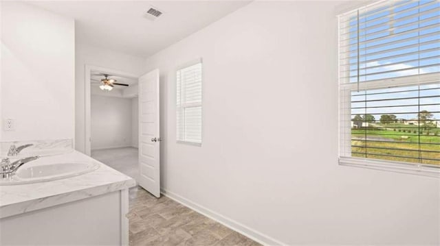 bathroom with vanity and ceiling fan