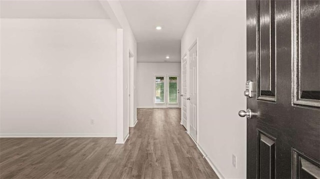 hallway featuring dark hardwood / wood-style flooring