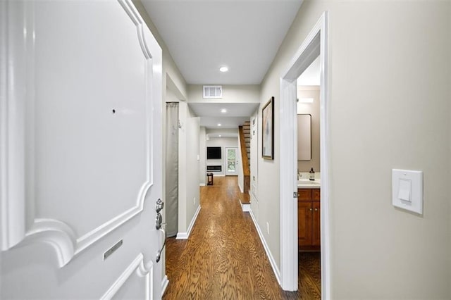 corridor with dark wood-type flooring