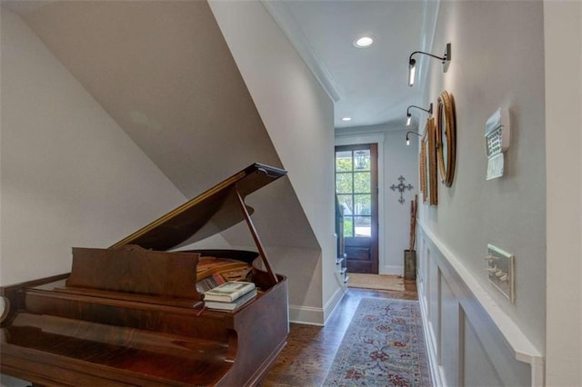 foyer entrance with dark hardwood / wood-style floors and ornamental molding