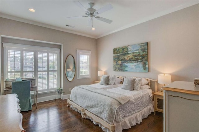 bedroom with ceiling fan, dark hardwood / wood-style floors, and ornamental molding