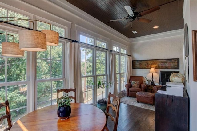 sunroom / solarium with ceiling fan and wood ceiling