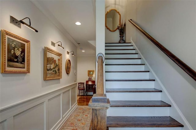 staircase featuring ornamental molding