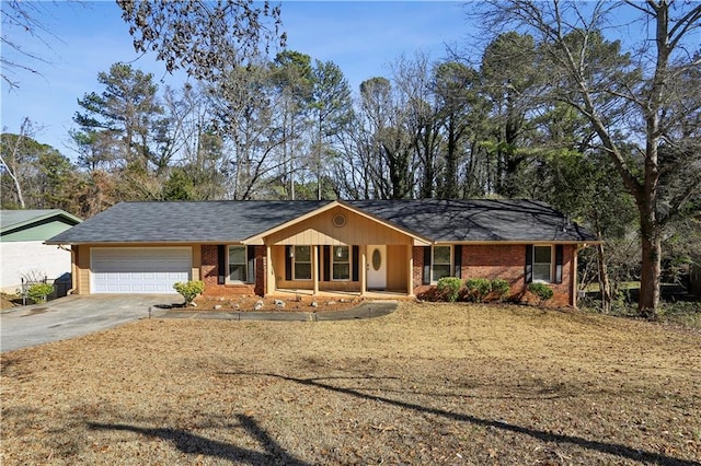 single story home with a garage and covered porch