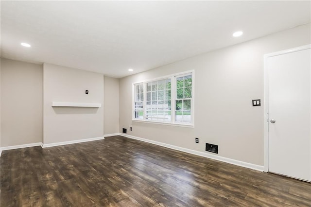 unfurnished living room featuring wood finished floors, baseboards, and recessed lighting