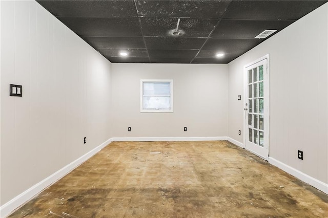 spare room featuring baseboards