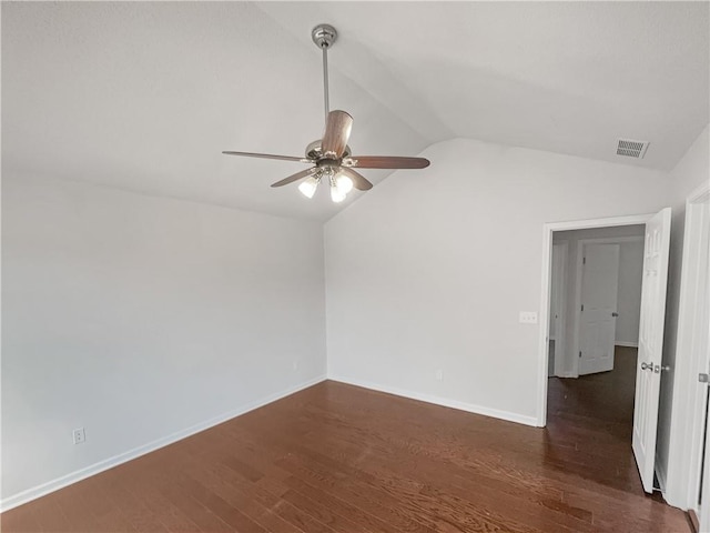 unfurnished room featuring lofted ceiling, dark wood-type flooring, and ceiling fan