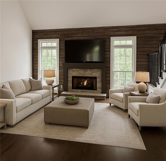 8625 Anchor On Lanier Ct, Gainesville, GA 30506 - living area with stairs, wooden walls, a lit fireplace, vaulted ceiling, and wood finished floors