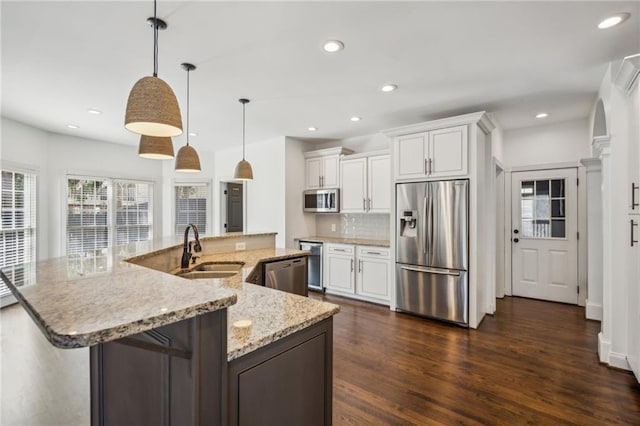 8625 Anchor On Lanier Ct, Gainesville, GA 30506 - kitchen featuring appliances with stainless steel finishes, dark wood-style floors, backsplash, recessed lighting, and a spacious island