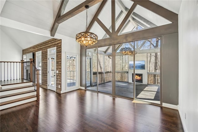 8625 Anchor On Lanier Ct, Gainesville, GA 30506 - unfurnished room with a chandelier, high vaulted ceiling, wood finished floors, beam ceiling, and stairway
