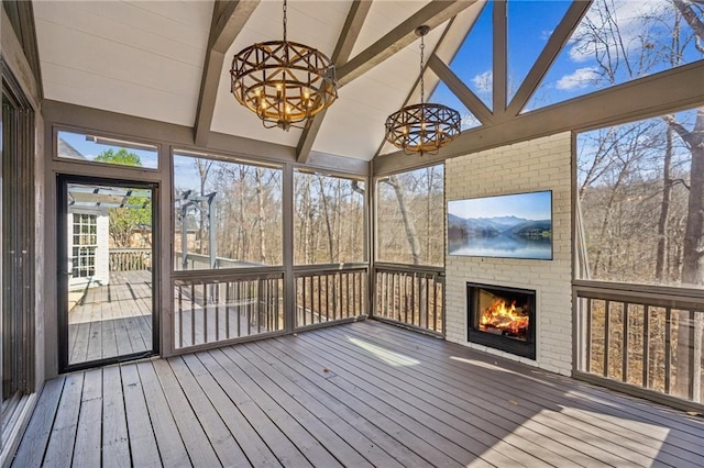 8625 Anchor On Lanier Ct, Gainesville, GA 30506 - unfurnished sunroom featuring a fireplace and a chandelier