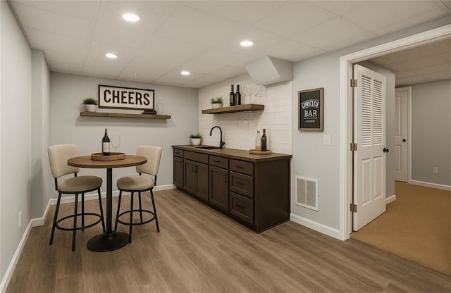 8625 Anchor On Lanier Ct, Gainesville, GA 30506 - indoor wet bar with a paneled ceiling, light wood-style flooring, recessed lighting, and backsplash