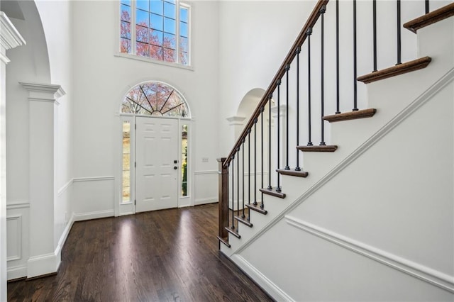 8625 Anchor On Lanier Ct, Gainesville, GA 30506 - entryway with wood finished floors, stairway, a high ceiling, and arched walkways