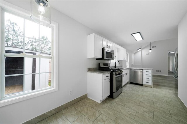 1031 Abercorn Way, Douglasville, GA 30134 - kitchen featuring white cabinetry, a sink, appliances with stainless steel finishes, visible vents, and a peninsula
