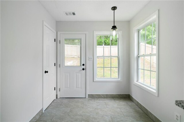 1031 Abercorn Way, Douglasville, GA 30134 - doorway to outside featuring a wealth of natural light, visible vents, marble finish floor, and baseboards
