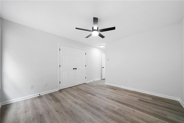 1031 Abercorn Way, Douglasville, GA 30134 - spare room featuring ceiling fan, wood finished floors, and baseboards