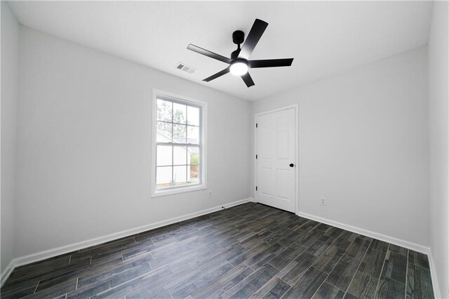 1031 Abercorn Way, Douglasville, GA 30134 - empty room featuring visible vents, a ceiling fan, dark wood-style floors, and baseboards